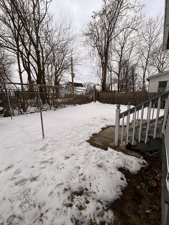 73 Lebanon Street Springfield, MA 01109 - Photo 4 of 19 a view of a backyard of snow
