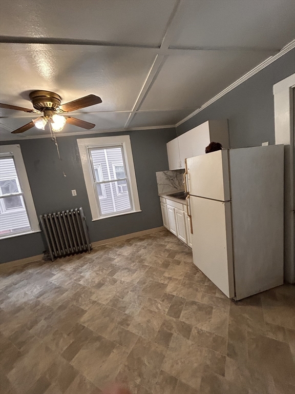 73 Lebanon Street Springfield, MA 01109 - Photo 7 of 19 a view of a hallway with a refrigerator