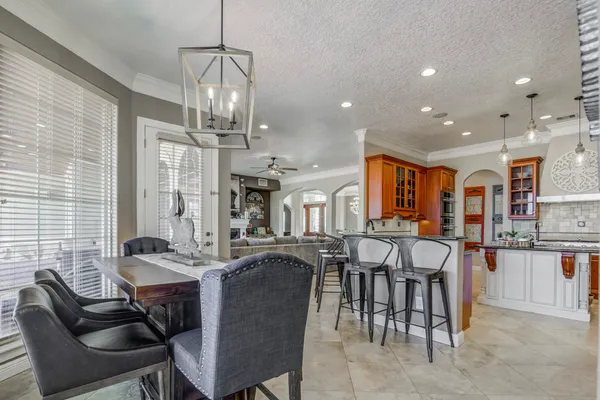 a kitchen with stainless steel appliances granite countertop a sink and cabinets