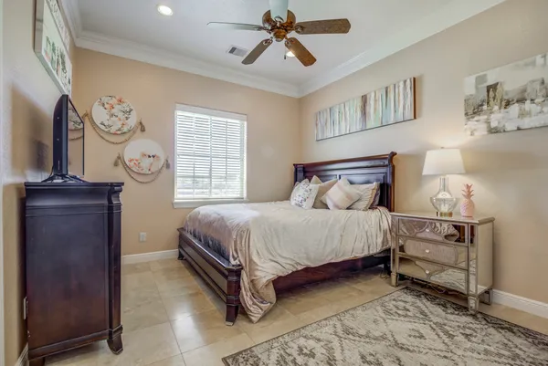 a bedroom with furniture and a window