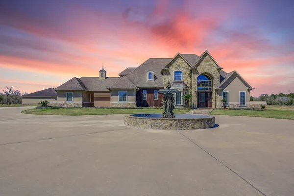 an aerial view of a house with outdoor space lake view