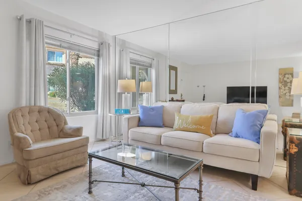 a living room with furniture and a large window