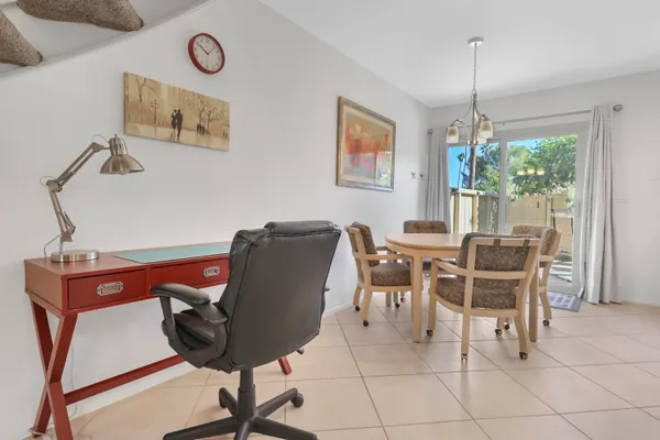 a dining room with furniture and window