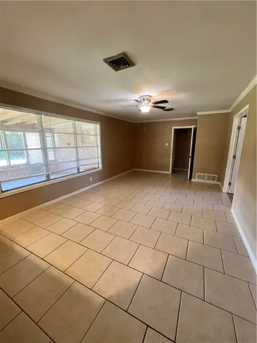 a view of an empty room and window