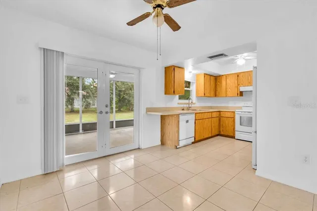 a view of a kitchen with a sink cabinets and a window