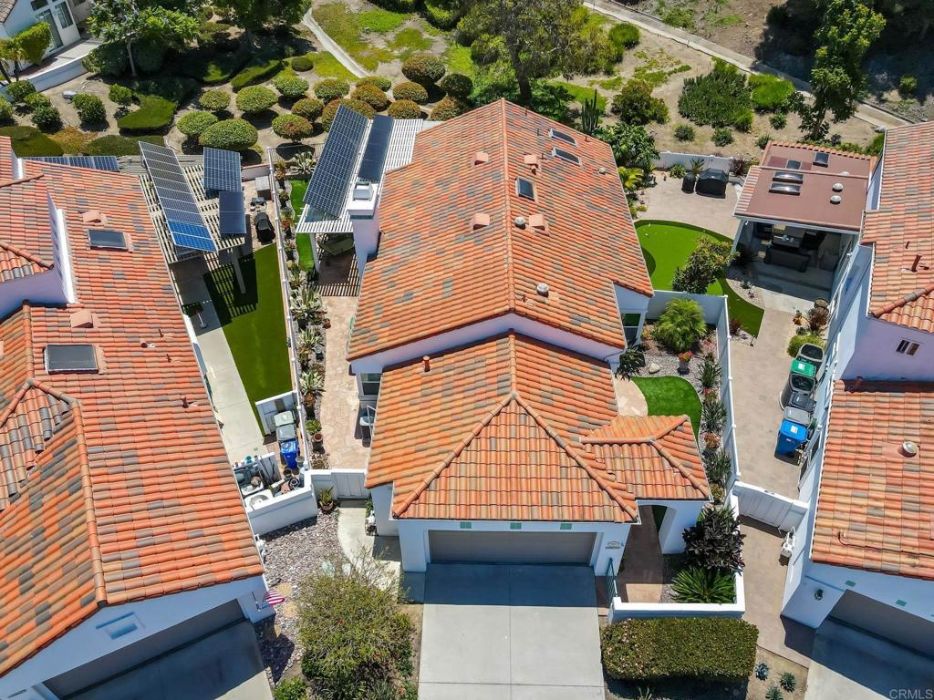 4939 Tilos Way Oceanside, CA 92056 - Photo 33 of 49 an aerial view of a house with a garden
