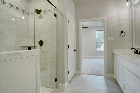 a bathroom with a bathtub and shower