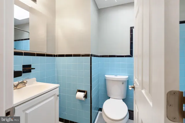 a bathroom with a toilet and a sink