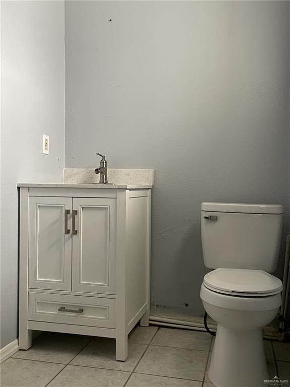 412 East 18th Street, Unit A Weslaco, TX 78596 - Photo 8 of 13 Half bath featuring vanity and light tile patterned floors