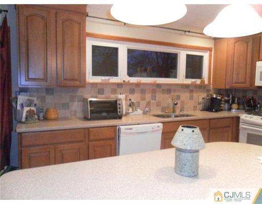 13 Lehigh Road Old Bridge, NJ 08859 - Photo 2 of 13 a kitchen with a sink and a stove top oven
