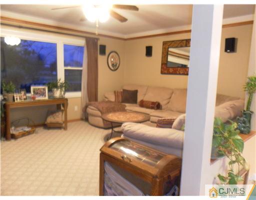 13 Lehigh Road Old Bridge, NJ 08859 - Photo 5 of 13 a living room with furniture and a floor to ceiling window