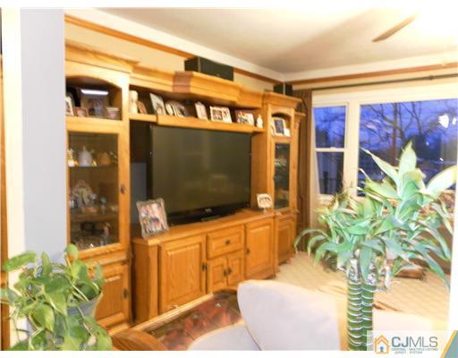 13 Lehigh Road Old Bridge, NJ 08859 - Photo 6 of 13 a living room with flat screen tv furniture and potted plant