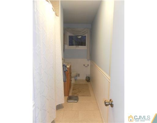 13 Lehigh Road Old Bridge, NJ 08859 - Photo 9 of 13 a bathroom with a toilet and a shower