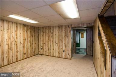 6941 Belclare Road Baltimore, MD 21222 - Photo 13 of 20 Finished club room with new carpeting