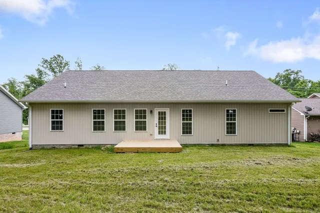 a front view of a house with yard