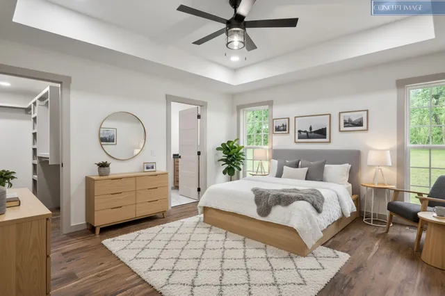 a bedroom with a large bed and a dresser