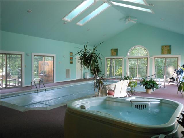 489 Pond Apple Road Clarksville, TN 37043 - Photo 2 of 17 Gorgeous Pool Room with skylights, sliding glass doors, ceilings fans, and therapeutic hot tub spa. The pool is maintained with Baquacil.