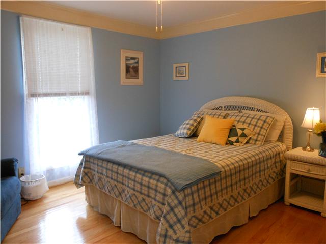 489 Pond Apple Road Clarksville, TN 37043 - Photo 11 of 17 Bedroom 2 features hardwood flooring and a ceiling fan.