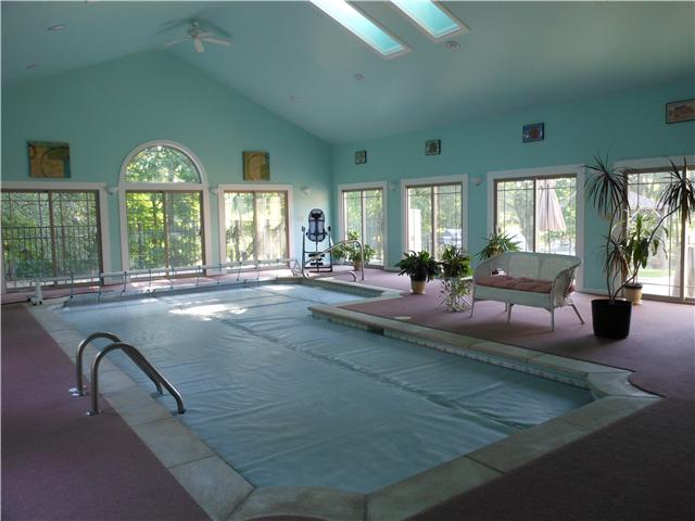 489 Pond Apple Road Clarksville, TN 37043 - Photo 14 of 17 One more look at the gorgeous Pool Room. All 9 of the sliding glass doors and the arch window were replaced in 2012.