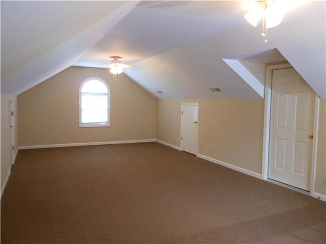 489 Pond Apple Road Clarksville, TN 37043 - Photo 7 of 17 Huge Bonus Room with lots of storage areas. Access to the attic leads to a large floored area for even more storage.