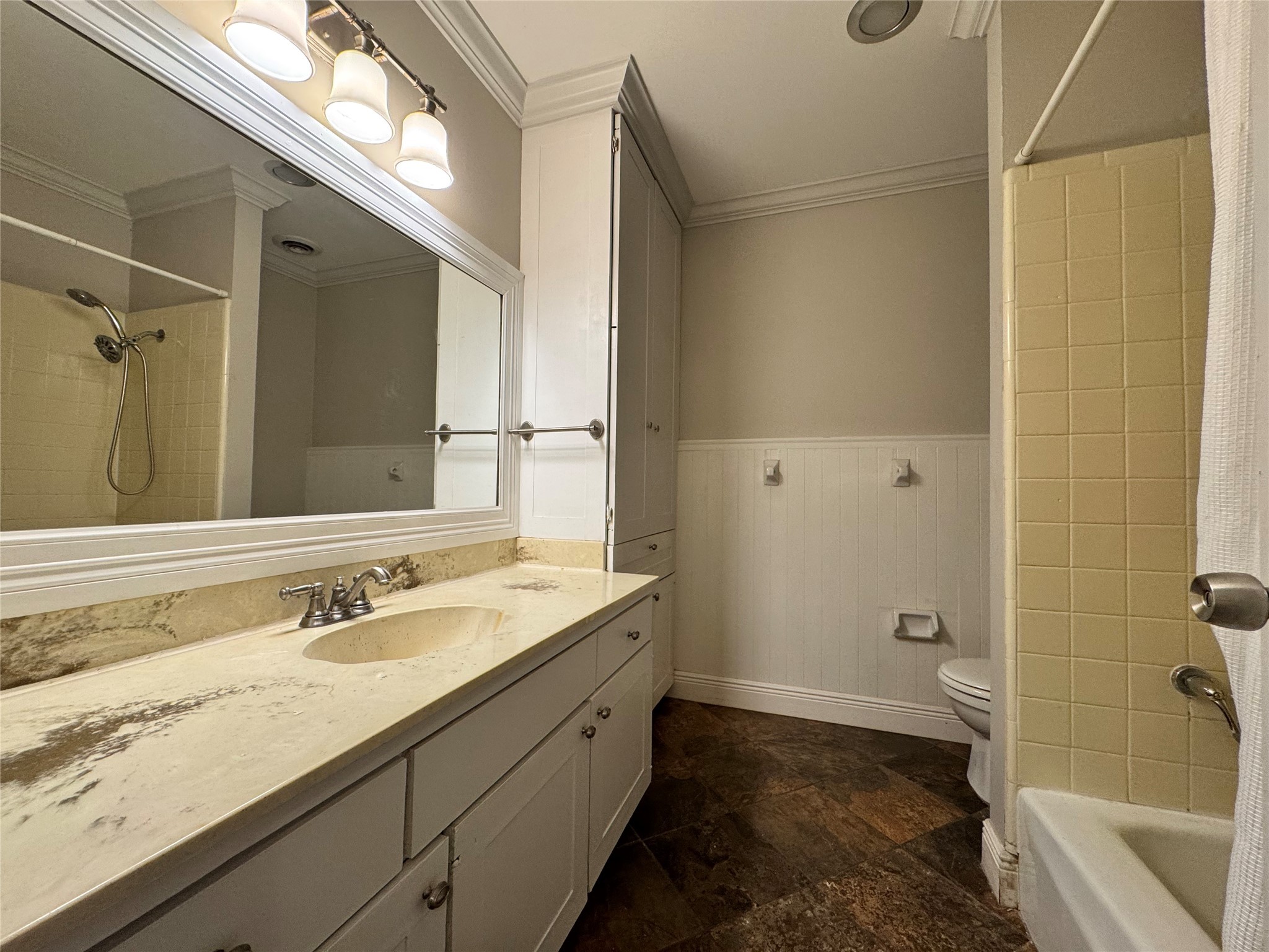 2041 Winrock Boulevard, Unit 157 Houston, TX 77057 - Photo 13 of 26 a bathroom with a granite countertop sink toilet and shower