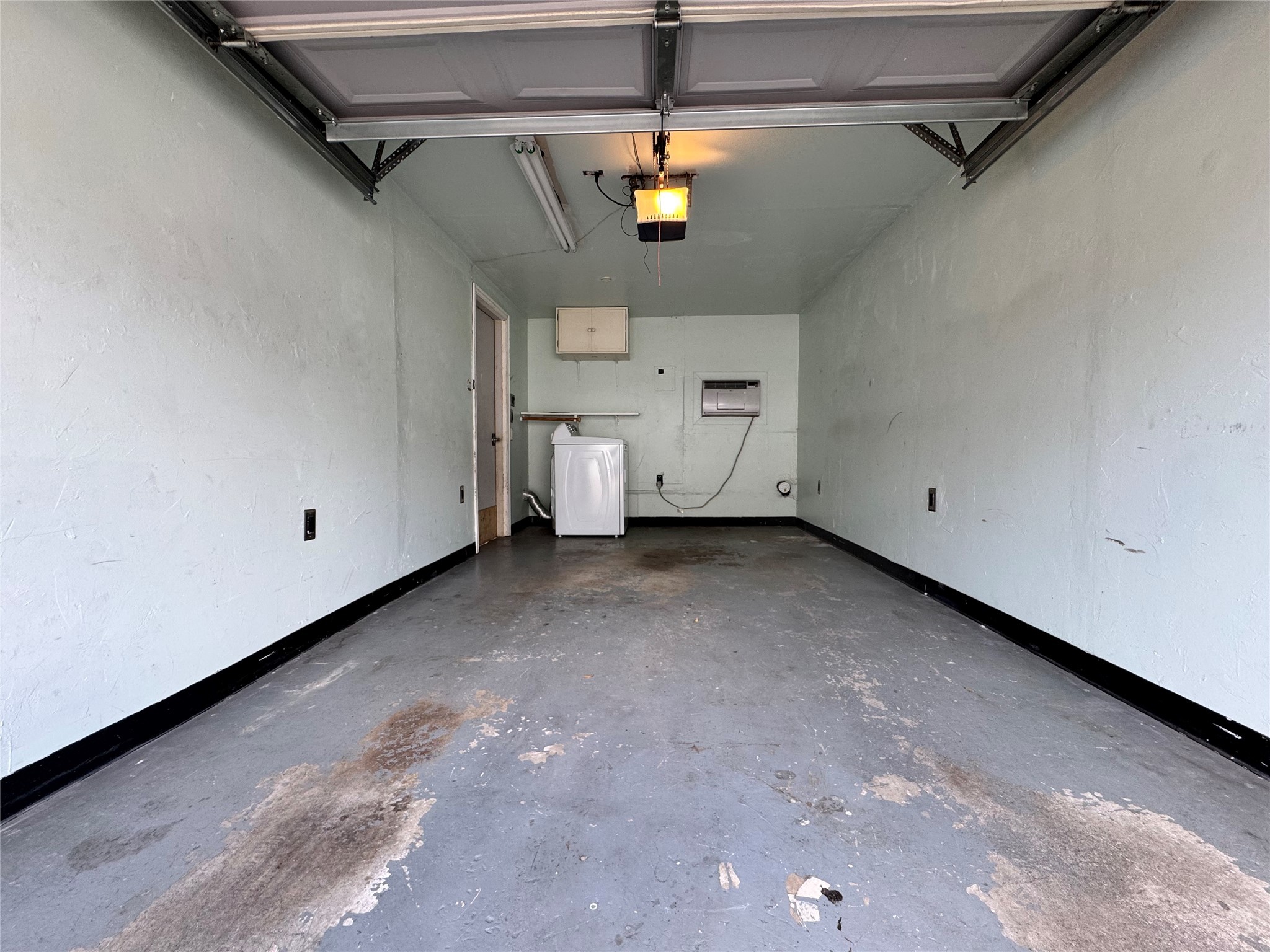2041 Winrock Boulevard, Unit 157 Houston, TX 77057 - Photo 16 of 26 a view of a garage