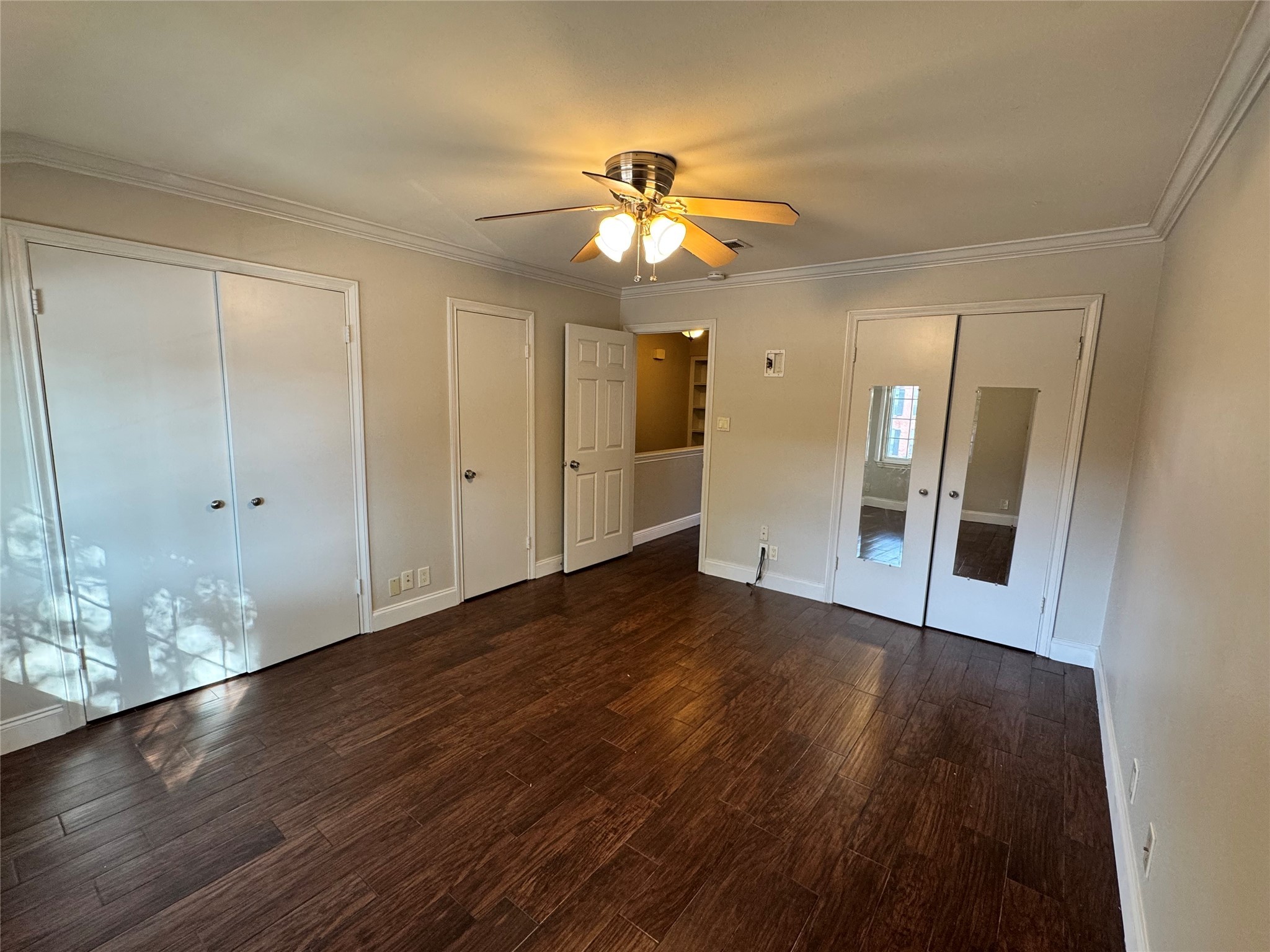2041 Winrock Boulevard, Unit 157 Houston, TX 77057 - Photo 9 of 26 a view of an empty room with wooden floor and a window