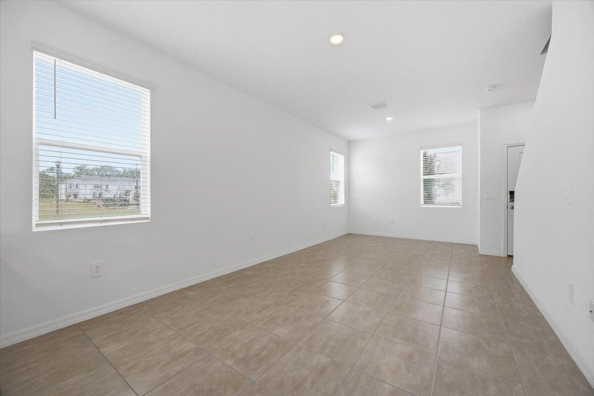 2907 Skyline Loop Kissimmee, FL 34758 - Photo 3 of 12 a view of an empty room with a window