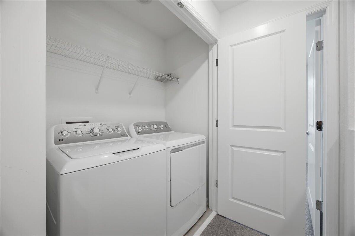 2907 Skyline Loop Kissimmee, FL 34758 - Photo 9 of 12 a utility room with dryer and washer