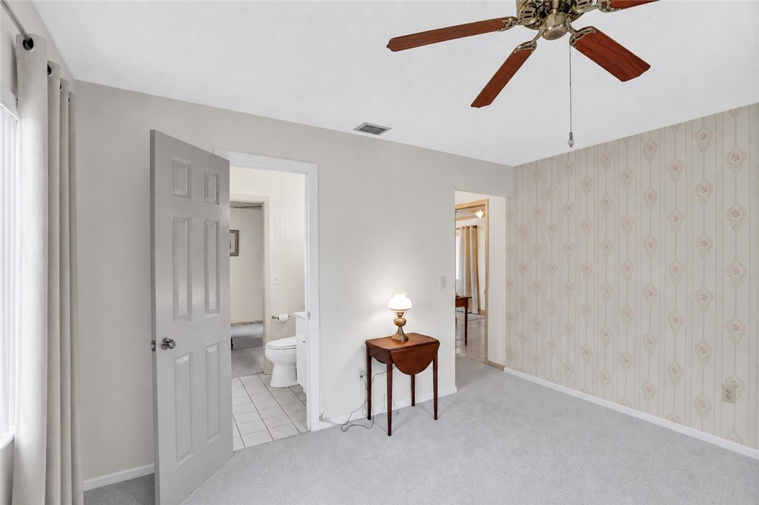 7666 134th Street Sebastian, FL 32958 - Photo 12 of 35 a view of a room with a stylish ceiling fan and entryway