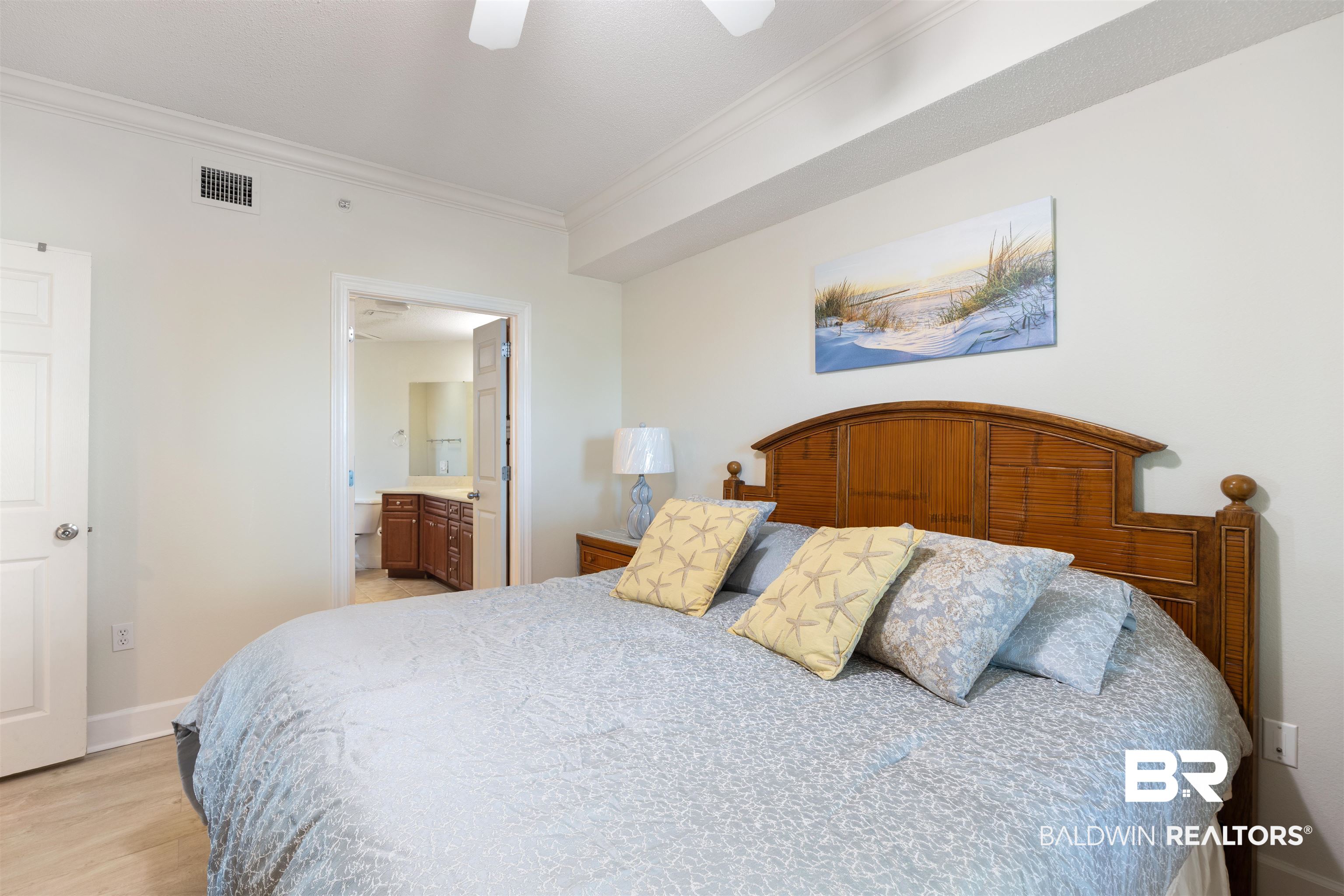 27580 Canal Road, Unit 1431 Orange Beach, AL 36561 - Photo 19 of 73 Bedroom featuring ornamental molding, ensuite bathroom, light wood-style floors, and ceiling fan