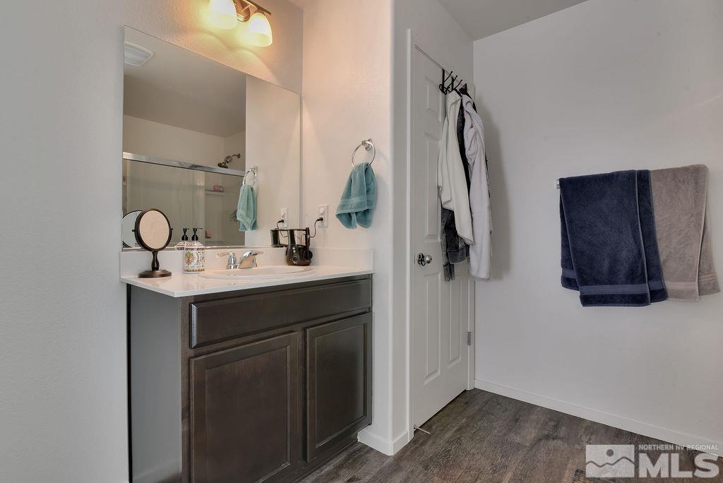 9622 Windjammer Way Reno, NV 89506 - Photo 16 of 29 a bathroom with a sink vanity and a mirror