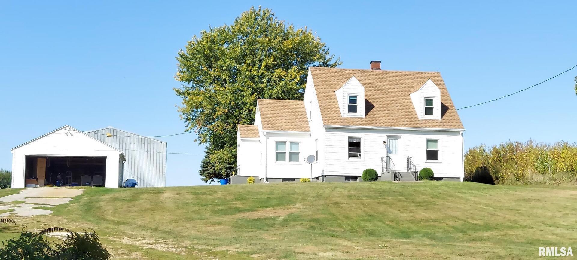 96 Highway 67 Alexis, IL 61412 - Photo 1 of 24 a front view of a house with a yard