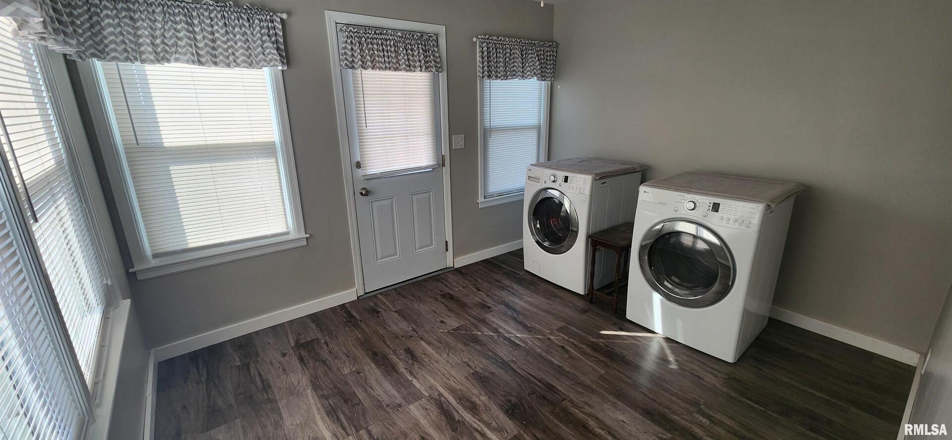 96 Highway 67 Alexis, IL 61412 - Photo 21 of 24 a utility room with wooden floor and washing machine