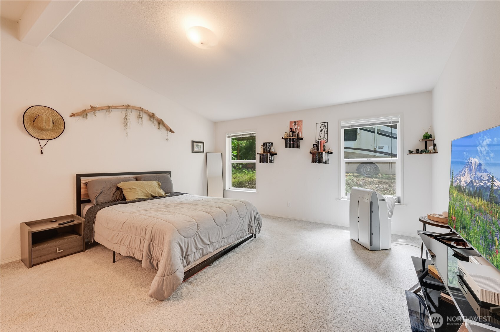 28818 Northeast Tolt Hill Road Carnation, WA 98014 - Photo 7 of 12 a bedroom with a bed closet and a window
