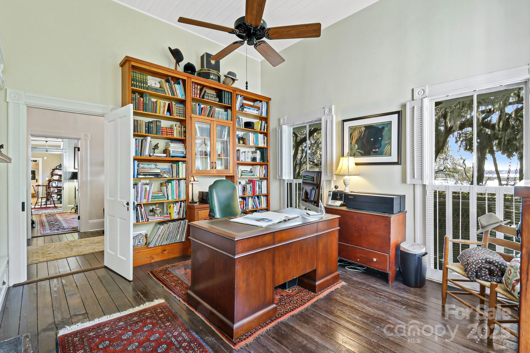 131 Pritchard Street Bluffton, SC 29910 - Photo 16 of 47 a bedroom with furniture and a book shelf