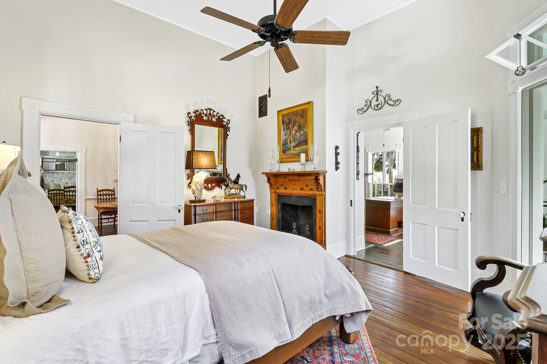 131 Pritchard Street Bluffton, SC 29910 - Photo 19 of 47 a bedroom with a bed and wooden floor