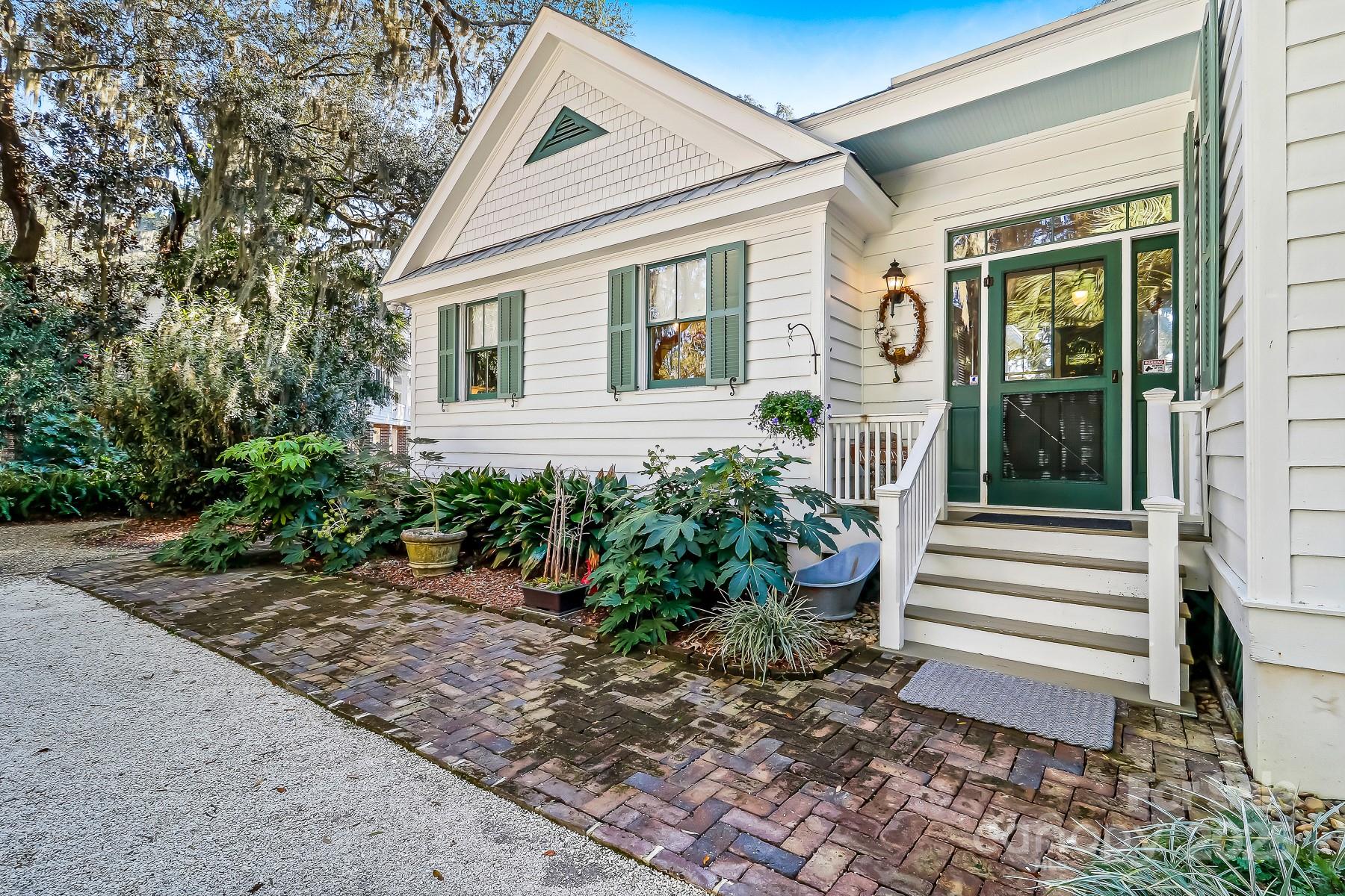 131 Pritchard Street Bluffton, SC 29910 - Photo 24 of 47 a front view of a house with garden