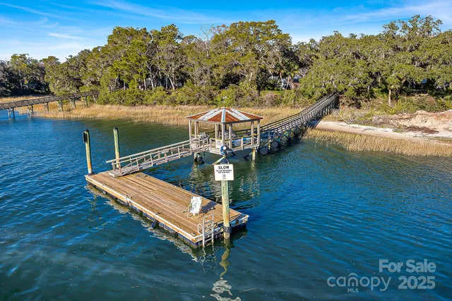 a view of a balcony with chairs and wooden floor