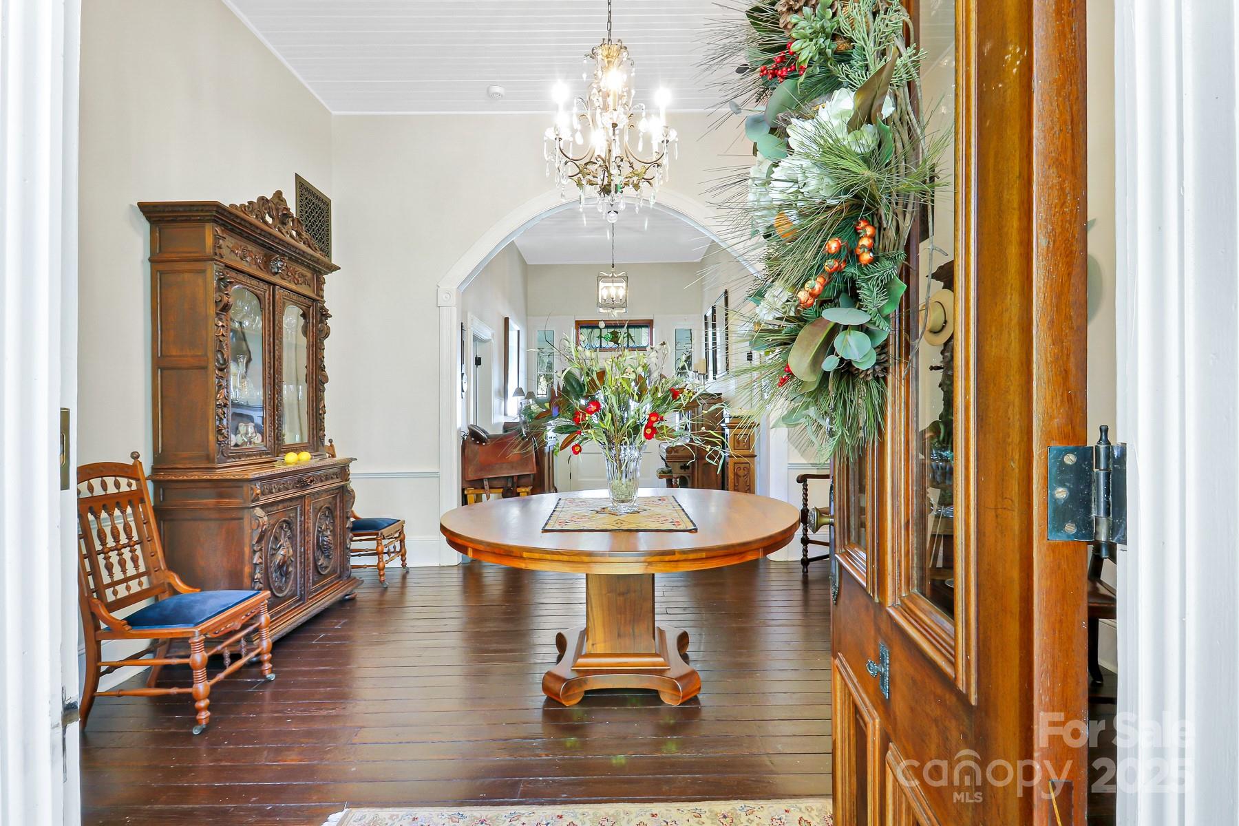 131 Pritchard Street Bluffton, SC 29910 - Photo 9 of 47 a dining room with chandelier and wooden floor