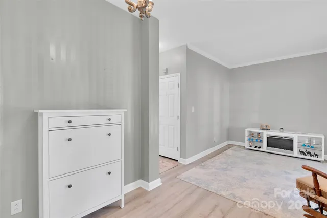 a view of a livingroom with dining room and hallway