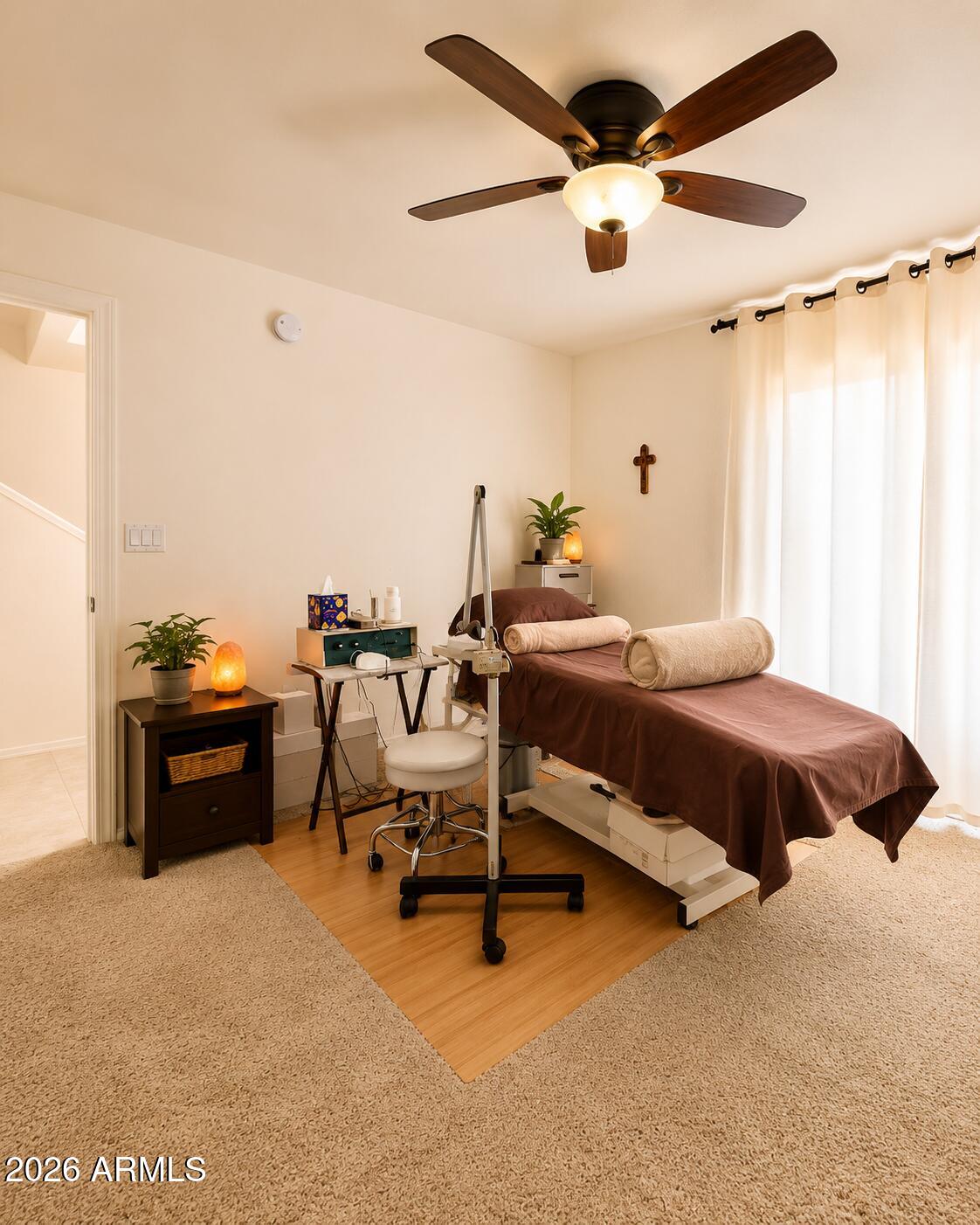 2150 West Alameda Road, Unit 1020 Phoenix, AZ 85085 - Photo 28 of 35 a bedroom with a bed and a chandelier