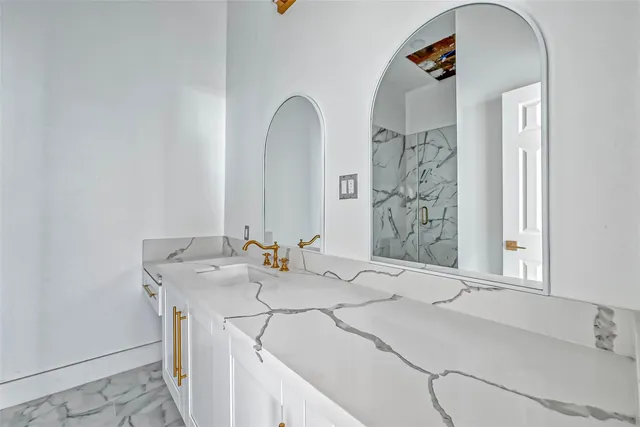 a bathroom with a sink and a mirror