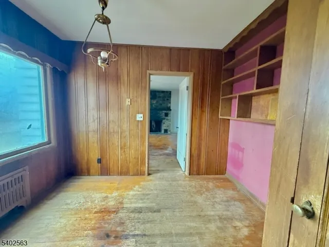 a view of room with a ceiling fan and window