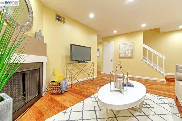 a bedroom with a bed and a night stand