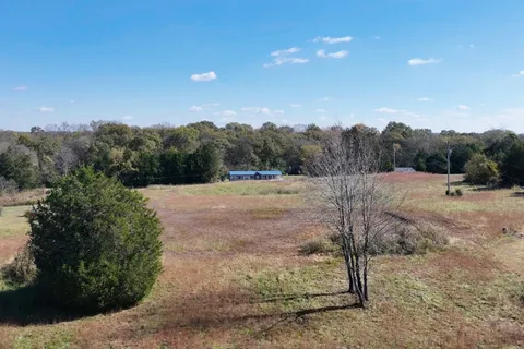a view of a lake with a big yard