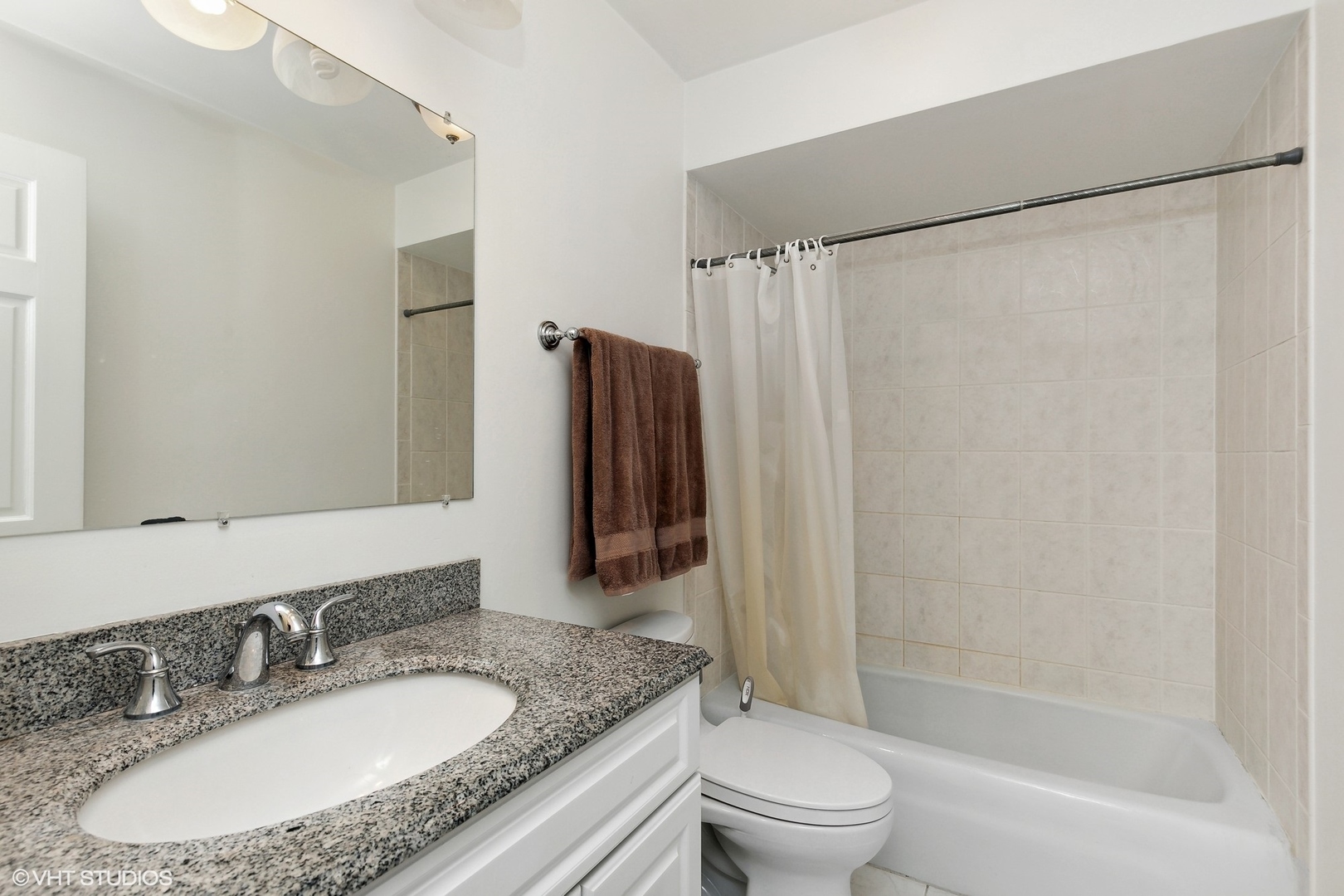 101 Bar Harbour Road, Unit 6E Schaumburg, IL 60193 - Photo 19 of 23 a bathroom with a granite countertop sink toilet and shower