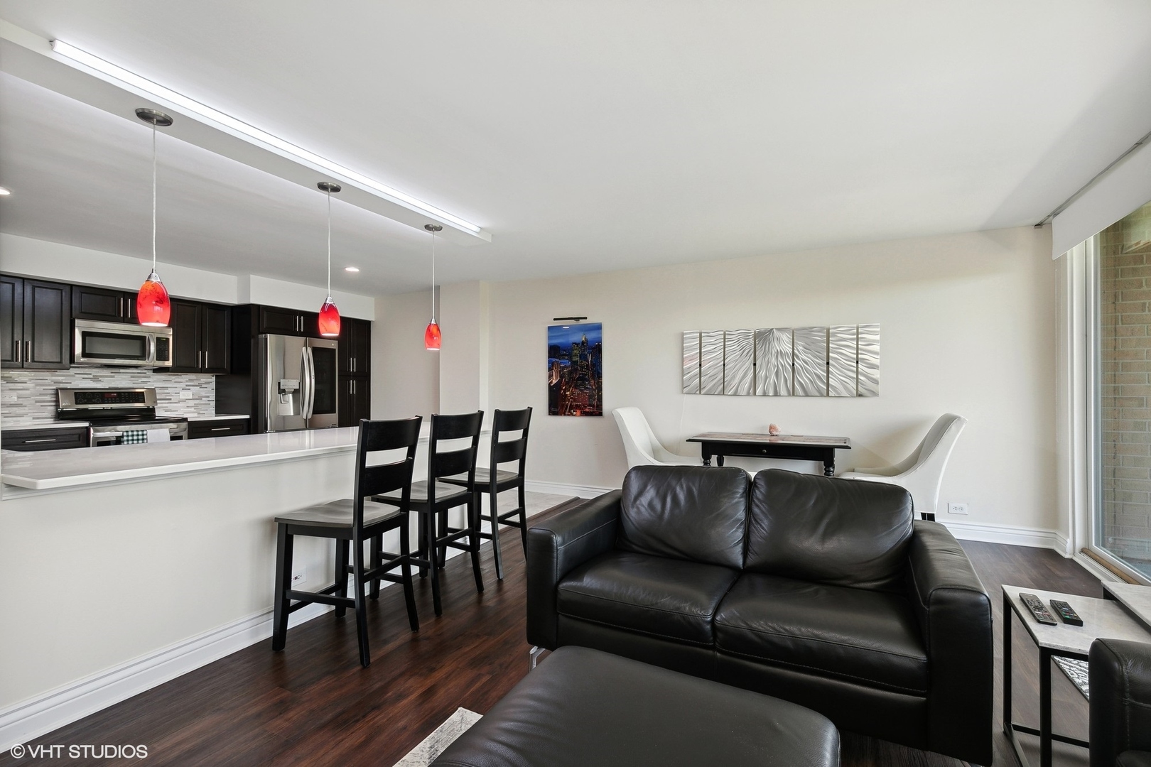 101 Bar Harbour Road, Unit 6E Schaumburg, IL 60193 - Photo 10 of 23 a living room with furniture kitchen view and a wooden floor
