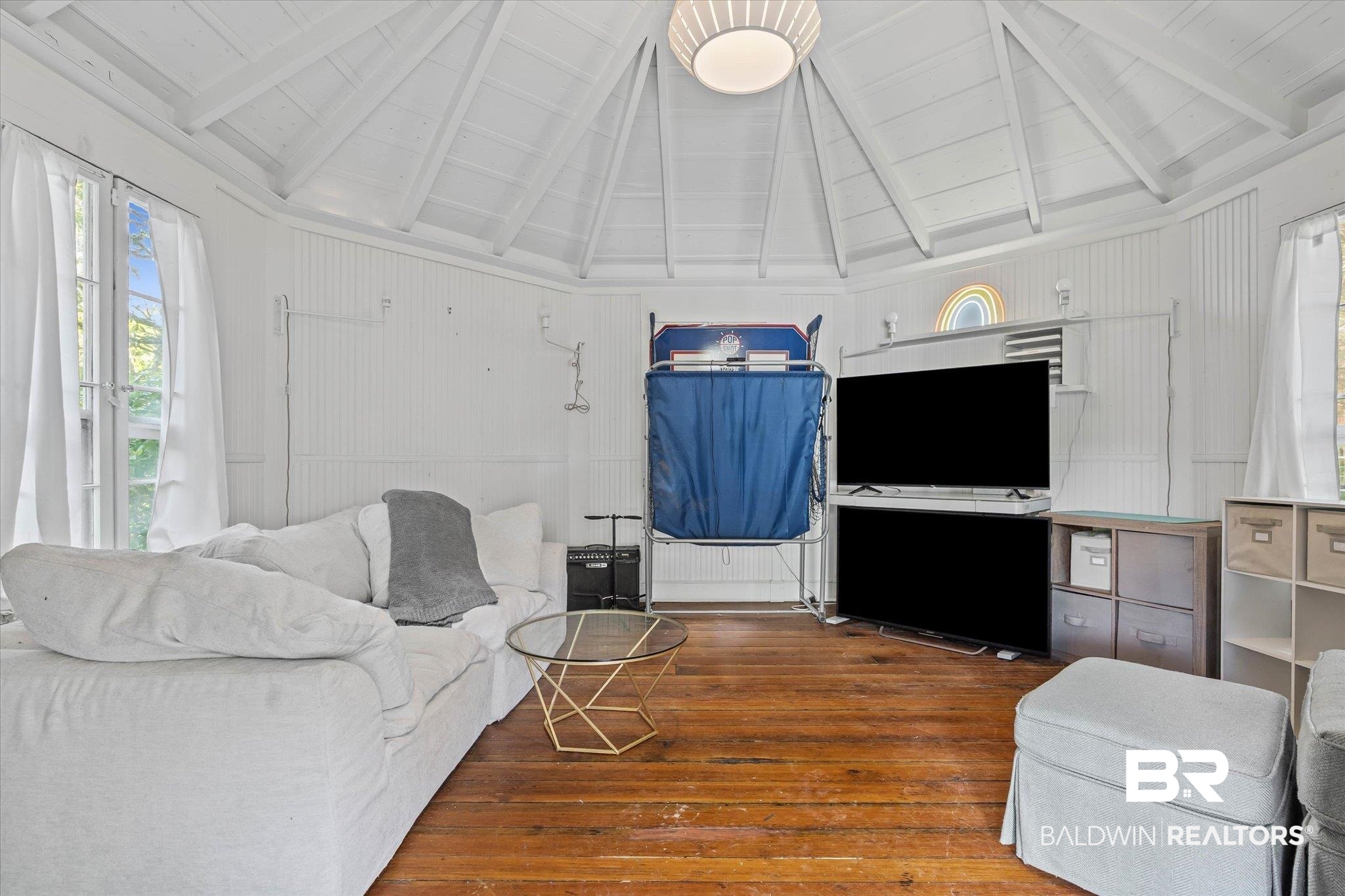 151 Tuthill Lane Mobile, AL 36608 - Photo 27 of 41 Living area with hardwood / wood-style flooring, beam ceiling, and high vaulted ceiling