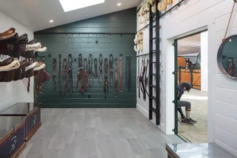 a dining room with furniture and a floor to ceiling window